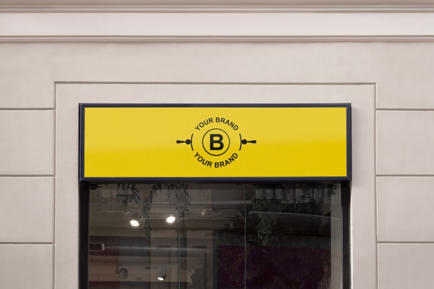 Logo mockup on facade or storefront Free Psd